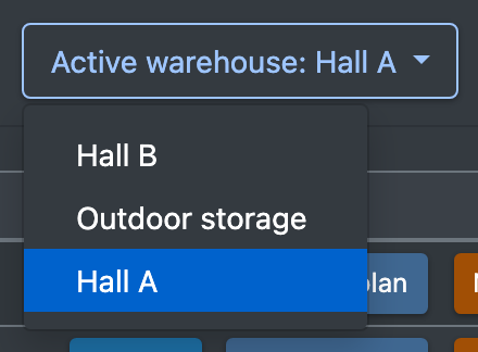 Screenshot: Warehouse drop-down at the top right of the WMS with two warehouses listed